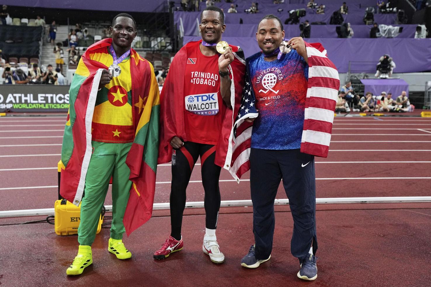 HISTORIC SWEEP: Trinidad and Tobago’s Keshorn Walcott, centre, proudly displays his 2025 World Athletics Championships men’s javelin gold medal at the Japan National Stadium, in Tokyo, on September 18. Grenada’s Anderson Peters, left, claimed silver, with bronze going to American Curtis Thompson.  —Photo: AP  Ashley Landis (Image obtained at trinidadexpress.com)