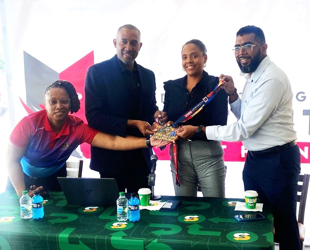 FLASHBACK – Project Administrator for Pink Reign Ministry of Sport and Community Development Latoya Thompson, left, with CEO Bafasports Nigel Bellamy, PRO-TTCG Kyadijah Lamy and Vice Prsident of Subway Johann Mendoza at the launch of Bafasports Midnight Marathon at Subway in Glencoe, in February 2025.  VASHTI SINGH (Image obtained at guardian.co.tt)